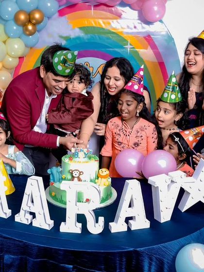 A thrilling 'Avengers' themed birthday party, with superhero cutouts, a cityscape backdrop, and dynamic balloon arrangements, ready for action.