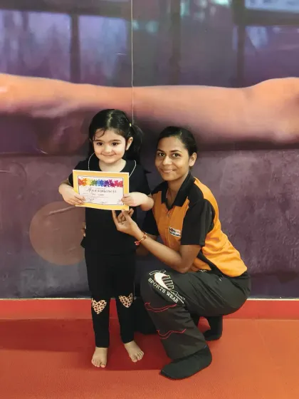 That proud smile says it all. We celebrate every milestone, and our certification program gives kids a wonderful sense of accomplishment as they master new skills and earn their badges.