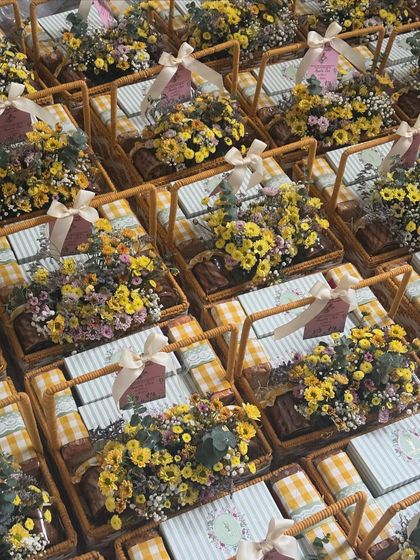 An overhead view of a large order of our summer gifting baskets. We can handle bulk orders for any occasion, ensuring each one is beautifully presented.