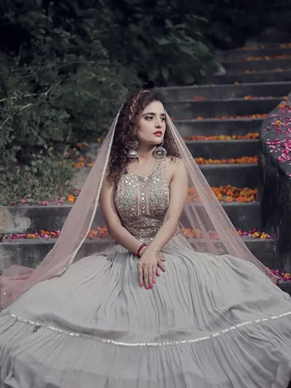 The full look of the grey lehenga, perfect for creating a dramatic and romantic vibe. The flowing skirt and delicate dupatta are made for beautiful pictures.