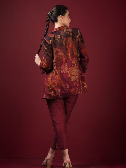 The back view of the printed blazer set, highlighting its sharp tailoring and unique pattern.