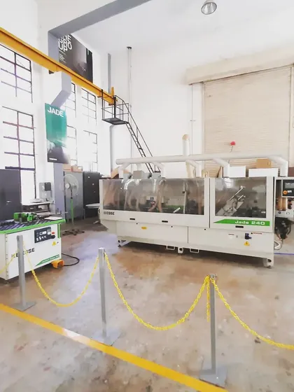 This is our Jade 240 edgebander, a machine that applies a clean, durable edge to panels cut on the CNC, a critical process in modern cabinet and furniture making.