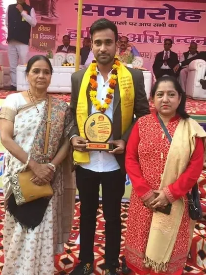 Posing with my award alongside esteemed guests at the event.