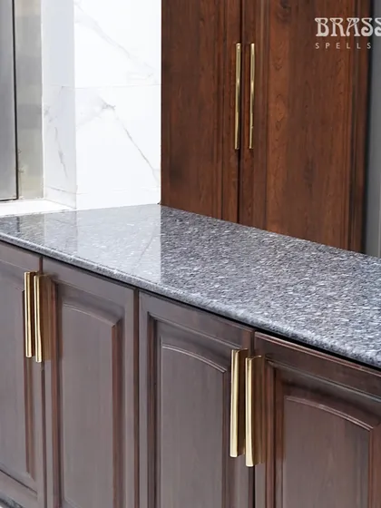 The long Kiah pulls used on pantry doors, demonstrating their suitability for larger-scale cabinetry.