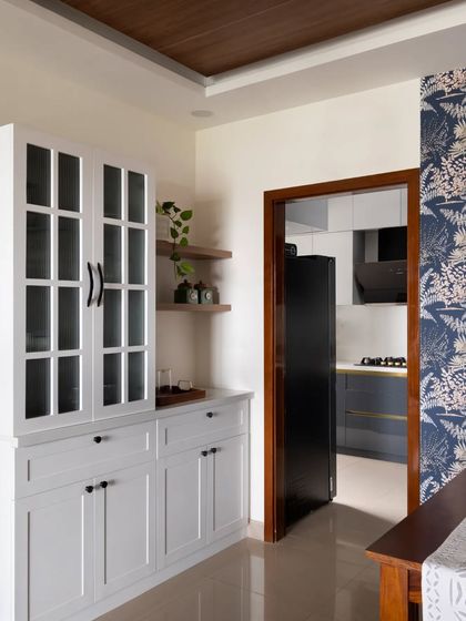 Another view of the English-style crockery unit, showing its placement next to the kitchen entryway.