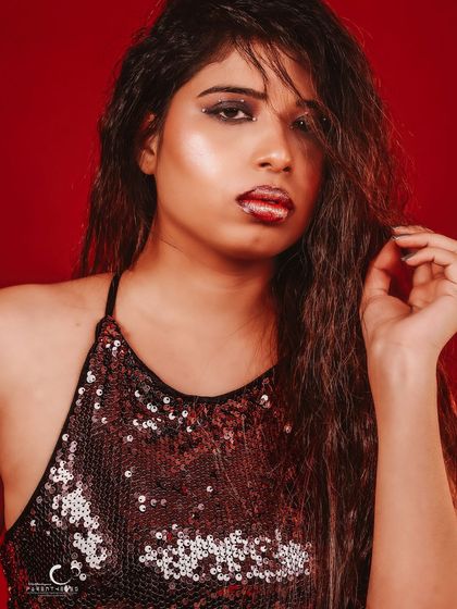 A softer, more thoughtful close-up. The lighting is more subdued, creating a moody and intimate portrait.