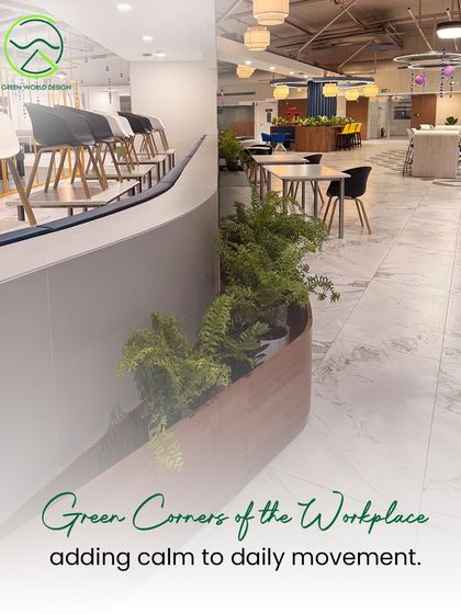 Green corners like this one at Accenture are strategically placed to add calm to high-traffic pathways. They serve as visual anchors that break the monotony of a typical office environment and improve the daily journey through the space.