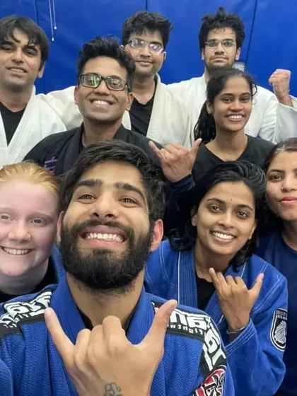 A diverse group of our Gi practitioners, all smiles after mastering a new submission.