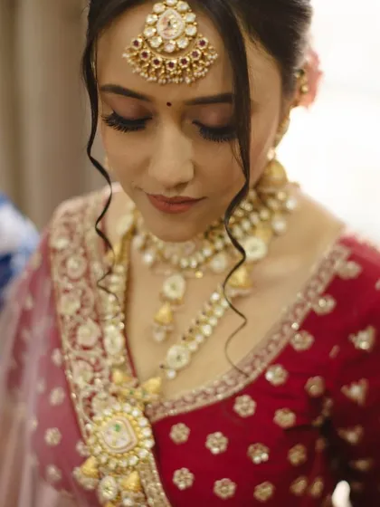 This shot focuses on the bride's eye makeup and jewelry. The soft, romantic eyeshadow and defined lashes make her eyes the focal point of the look.