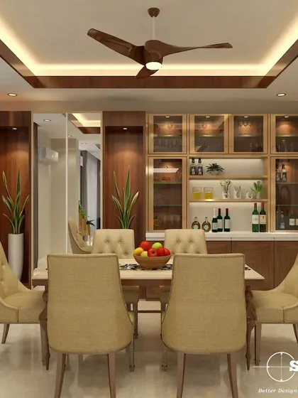 This dining area showcases a beautiful custom-built crockery unit with glass-front cabinets and integrated lighting. The warm wood tones and tufted dining chairs create a welcoming and elegant atmosphere for family meals.