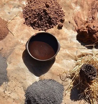 These are natural materials extracted directly from a project site. I often experiment with local soil, lime, and other earthy elements for use in sustainable techniques like cob construction, connecting the building to its environment.