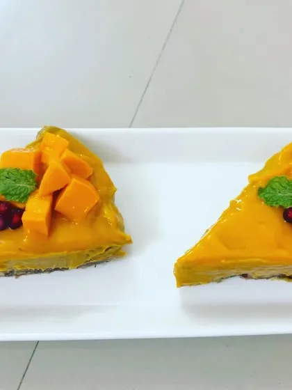 Here is my seasonal vegan mango cheesecake, a true celebration of flavor. It features a creamy cashew-based filling on a nutty crust, topped with fresh, juicy mangoes. It's a refreshing, plant-based dessert without any refined sugar.
