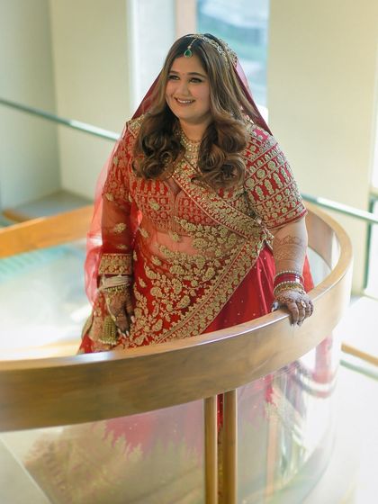 Another angle of the bride on the spiral staircase. Her makeup is flawless from every viewpoint, a testament to my detailed application process.