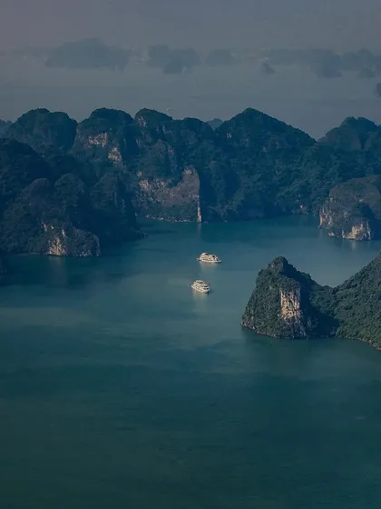 The limestone karsts of Ha Long Bay on a misty day. The landscape has an ethereal, mysterious quality that I tried to capture in this shot.