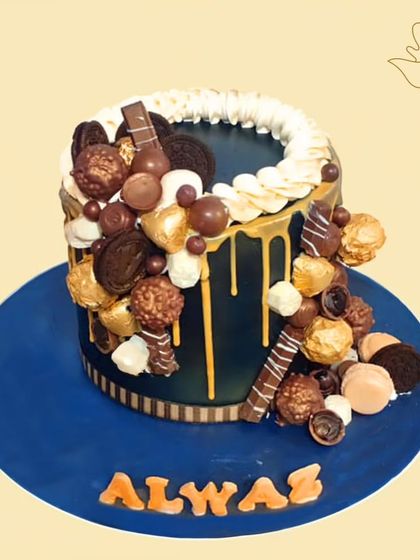 An extravagant chocolate overload cake, featuring a cascade of Ferrero Rocher, Oreos, and other chocolate treats. The golden drip adds a touch of luxury to this decadent creation.