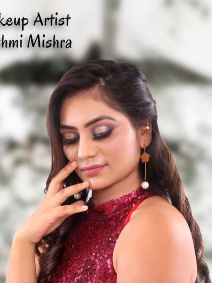 A self-portrait showcasing one of my party makeup looks. This features a shimmery eye and a bold lip, perfect for an evening out.