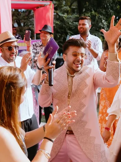 A candid shot from a high-energy wedding carnival. My goal is to be in the moment with the guests, sharing their laughter and making sure everyone is having a blast.