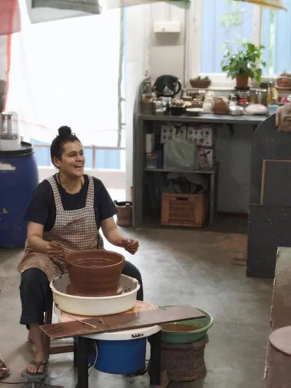 This is me in my element, at the potter's wheel in my studio. I believe in the therapeutic power of clay, and it is my greatest joy to share this passion with everyone who walks through my door.