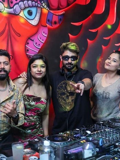 The whole crew together for a picture at the DJ booth.