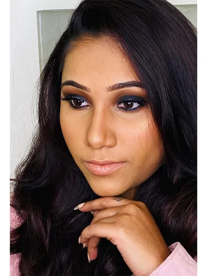 A side view of this modern Sangeet makeup. The focus is on the beautifully blended dark smokey eye, which adds a touch of mystery and allure.