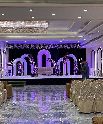 This is the Sky Banquet hall in Kharghar, set up and ready for a wedding. The stage is decorated with beautiful arches and lighting, and the hall has a seating capacity of up to 700 guests.
