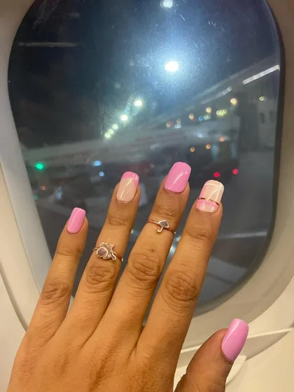 A perfect view from the window seat. These pink nails with minimalist line art are ready for takeoff on the next adventure.