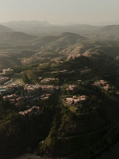 Another angle of the ITC Mementos resort, this time showing how the property is nestled within the Aravalli hills. This kind of shot helps sell the experience of a secluded, luxury getaway.