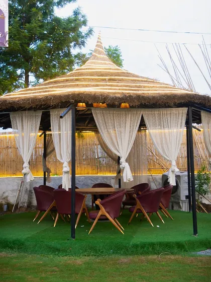 This larger cabana is perfect for small groups or families. It provides a shaded, private area to dine and relax together outdoors.