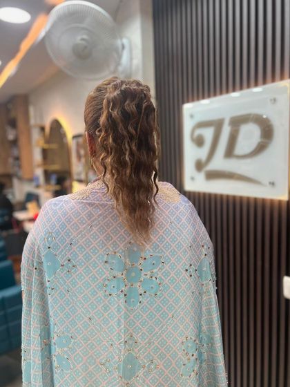 The back view of the high ponytail, showing its volume and texture.