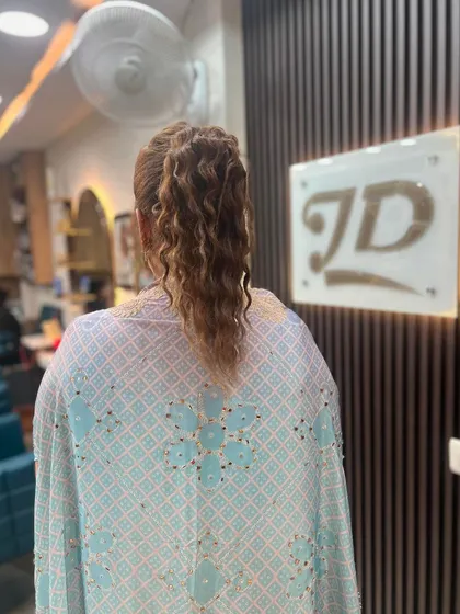 The back view of the high ponytail, showing its volume and texture.