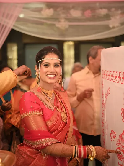 That smile is everything. A candid moment of our Maharashtrian bride during her wedding rituals, looking absolutely radiant and happy.