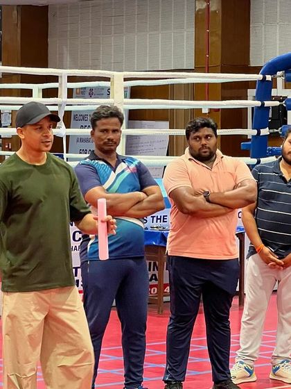 Answering questions from a small group of coaches. I make sure everyone has a chance to clear their doubts and understand the concepts.