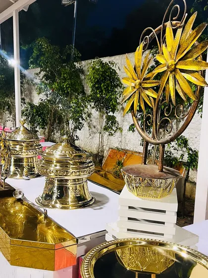 A close-up of my elegant buffet decor, featuring golden floral sculptures and premium brass serving dishes. Every detail is chosen to enhance the aesthetic of the food display.
