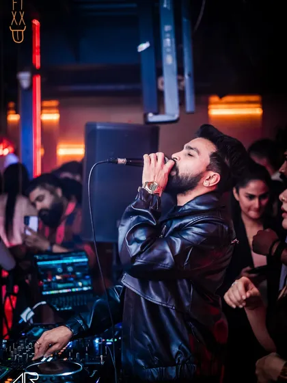 It's more than just playing tracks; it's about feeling the music and sharing that passion with everyone on the dance floor. This is me in my element, connecting with the crowd at The Fixx Bar during a high-energy Bollywood set.