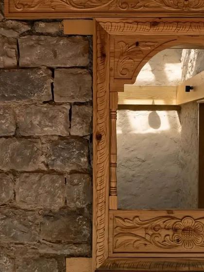 A close-up of the intricate Likhai woodwork, a traditional craft of the Rung community. We collaborated with local artisans to bring authentic cultural details into the museum's design.
