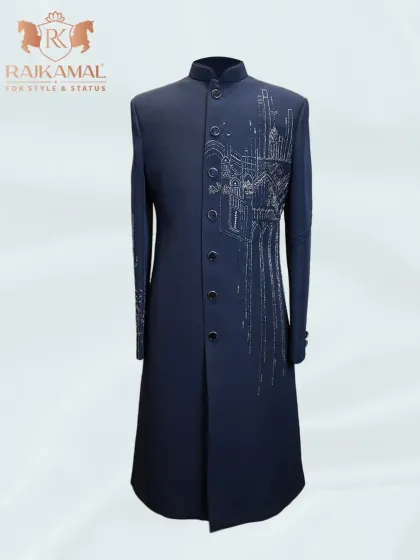 This longline navy blue Indo-Western piece features stunning silver embroidery depicting architectural motifs. It's a cool, contemporary take on ethnic wear.