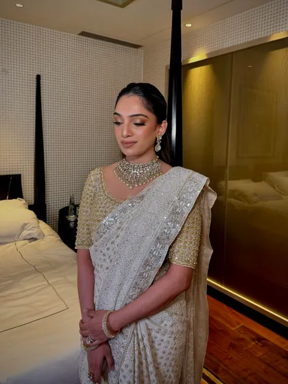 A full view of the elegant look for the Ambani wedding. The makeup is soft, glowing, and sophisticated, designed to be perfect for such a grand and memorable occasion.
