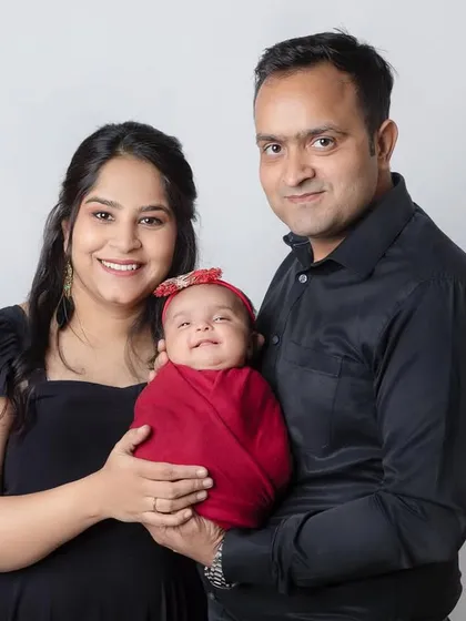 A beautiful newborn smile! It's rare to capture but so magical when it happens. A lovely first family portrait.
