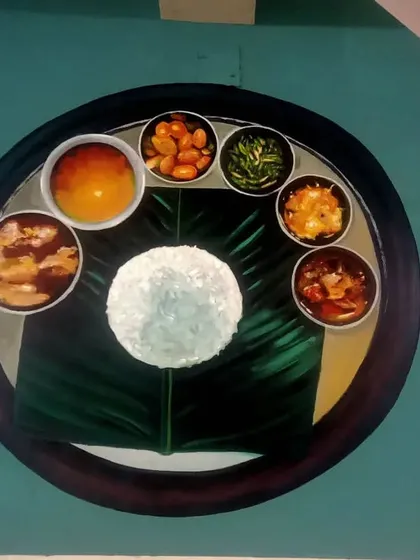 A mural painting of a traditional Indian thali served on a banana leaf. This piece celebrates the visual appeal and cultural significance of Indian cuisine.