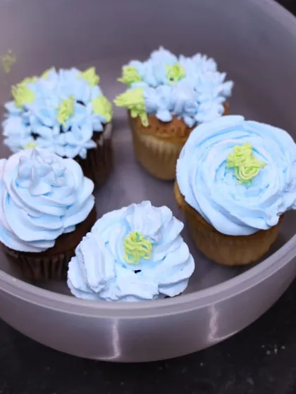 A collection of blue floral cupcakes made by students during one of my workshops. It's so rewarding to see everyone's creativity come to life.
