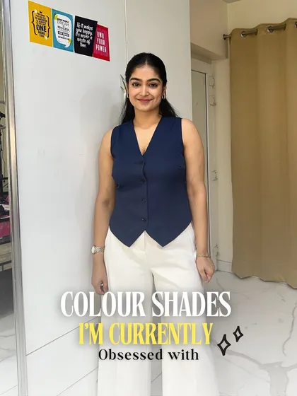 Here I am, showcasing some of the color shades I'm currently obsessed with. This navy vest paired with white trousers is a classic combination that always looks sharp.