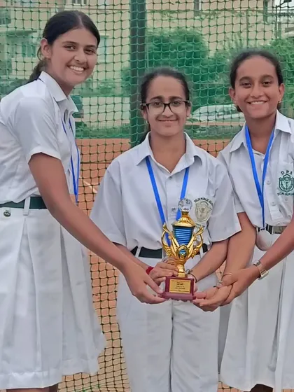 Vridhhi Mehrotra with her school team, proudly displaying their silver medal from the U14 Haryana State school zonal event. I encourage and support my players' school competitions.