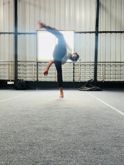 The dynamic motion of a spinning kick, captured mid-air. We teach the techniques for these advanced and visually impressive moves.