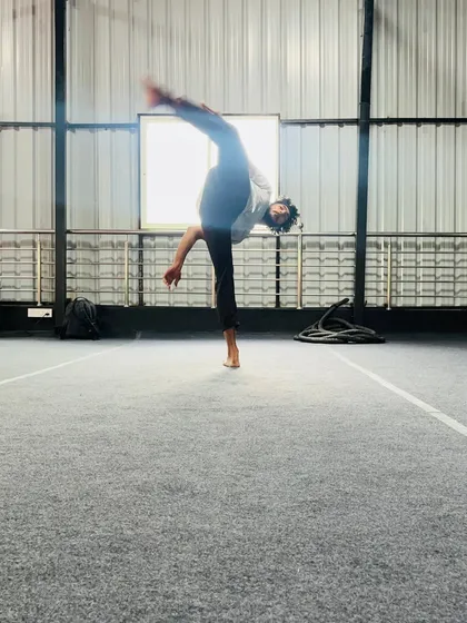 The dynamic motion of a spinning kick, captured mid-air. We teach the techniques for these advanced and visually impressive moves.