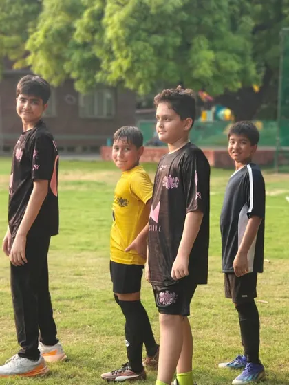 Posing with confidence. Our players develop self-assurance as they learn new skills and grow together as a team.