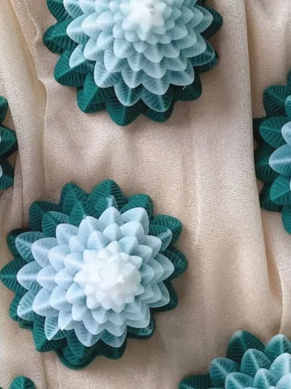 An overhead view of the ombre green Christmas tree candles.
