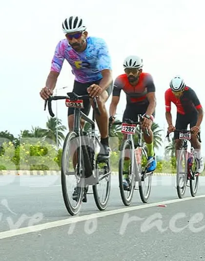 Three riders sprint towards the finish line. The final moments of a race are always the most thrilling, with every ounce of energy being used.