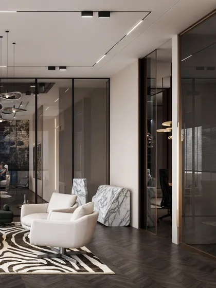 This view shows the glass partitions that separate the lounge from the private cabins, creating a sense of transparency.