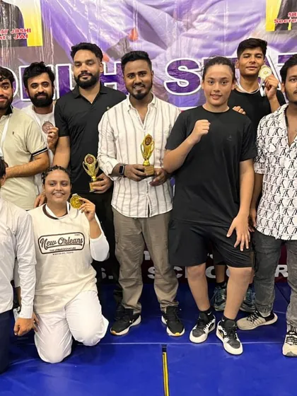 This is what discipline and hard work looks like. My team of fighters showing off their medals and trophies after a competition. I don't just train you; I build champions.