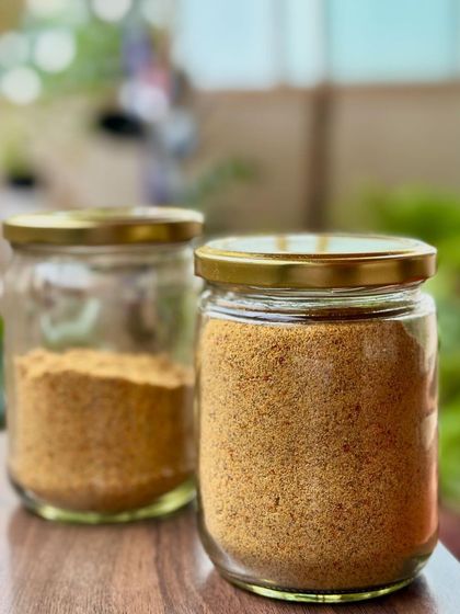 Two jars of freshly made flaxseed pudi. I love having this on hand to sprinkle over rice, idli, or dosa for an instant flavor and nutrition boost.